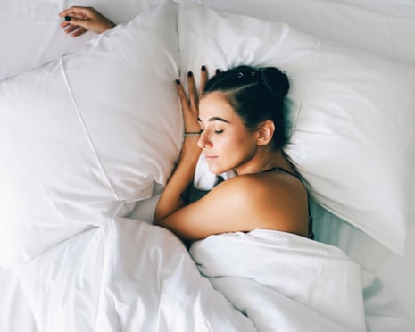 young woman sleeping in bed